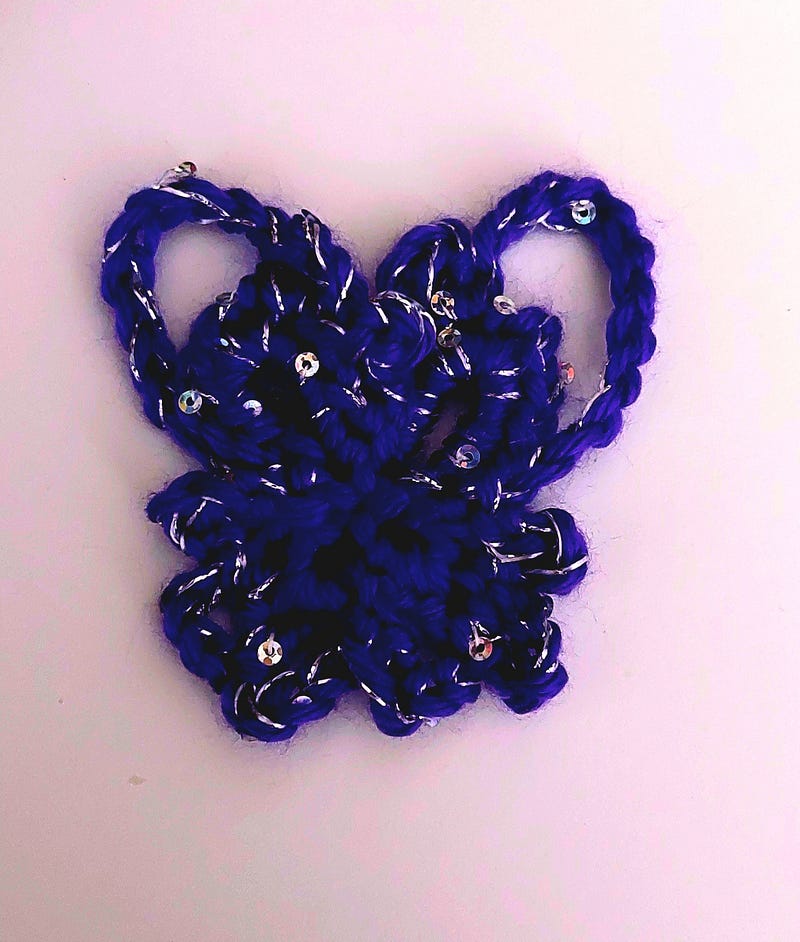 A crocheted butterfly showcasing a different design.